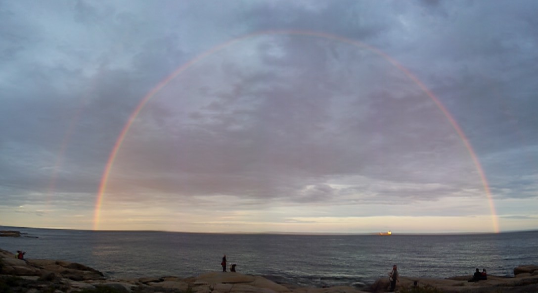 Rainbow over the St Lawrence River in Quebec while whale watching